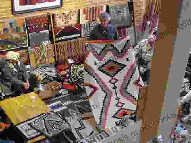 A Collector Examining A Navajo Rug In A Gallery Navajo Rugs: The Essential Guide