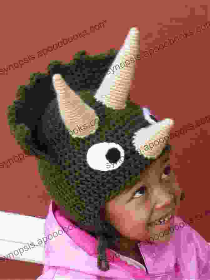 A Crocheted Triceratops Hat With Three Horns And A Frilly Neck Into The Wild Volume 2: 10 Animal Dinosaur Monster Crochet Hat Patterns