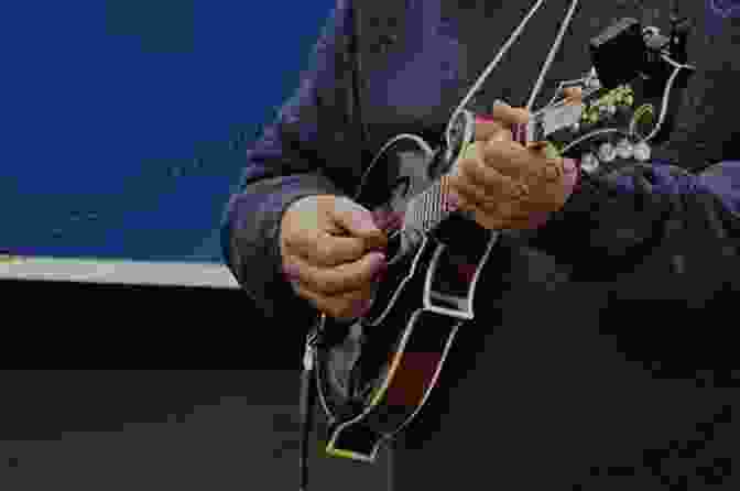 Photo Of A Person Playing The Mandolin Bill Monroe: Mandolin Play Along Volume 12 (Hal Leonard Mandolin Play Along)